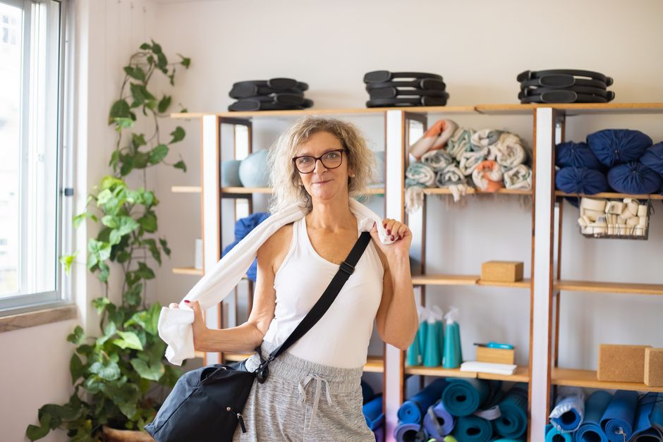 Bolsters, blocks and straps stacked neatly on a shelf
