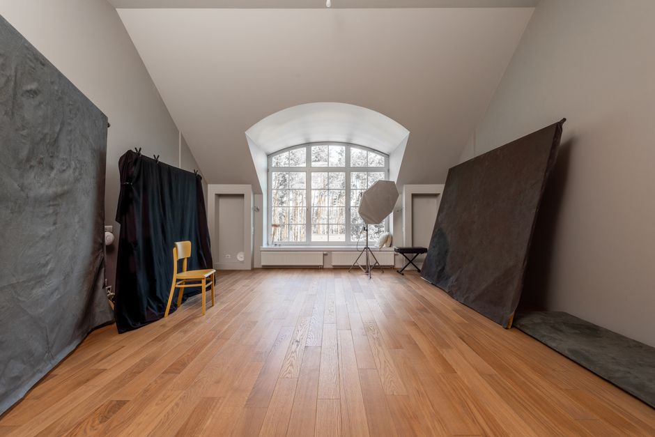 Tall windows filling the studio with natural light