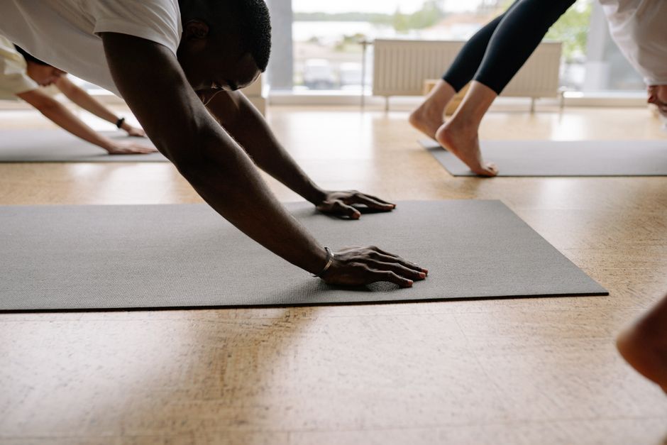 A small group moving through a vinyasa flow together